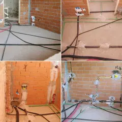 Instalacja gazowa w trakcie budowy. Widać przewody gazowe i elektryczne w ścianach i na podłodze.